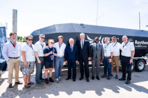 Attendees in front of Raytheon Vessel