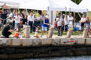 Throwing underwater vehicle into water from pier